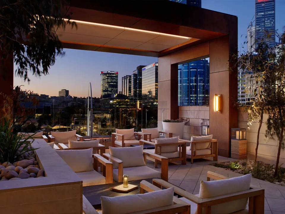 The Songbird Bar and Lounge terrace at dusk
