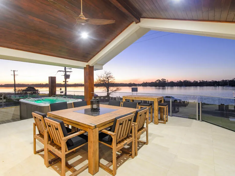 Alfresco dining with water views at sunset