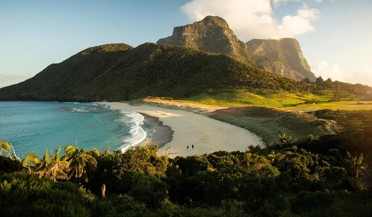 Capella Lodge, Lord Howe Island: a beach beneath a mountain range