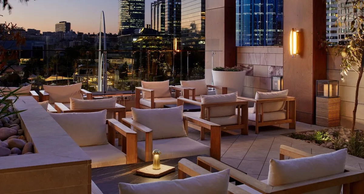 The Ritz-Carlton, Perth: Songbird rooftop terrace at dusk with the Elizabeth Quay arch behind