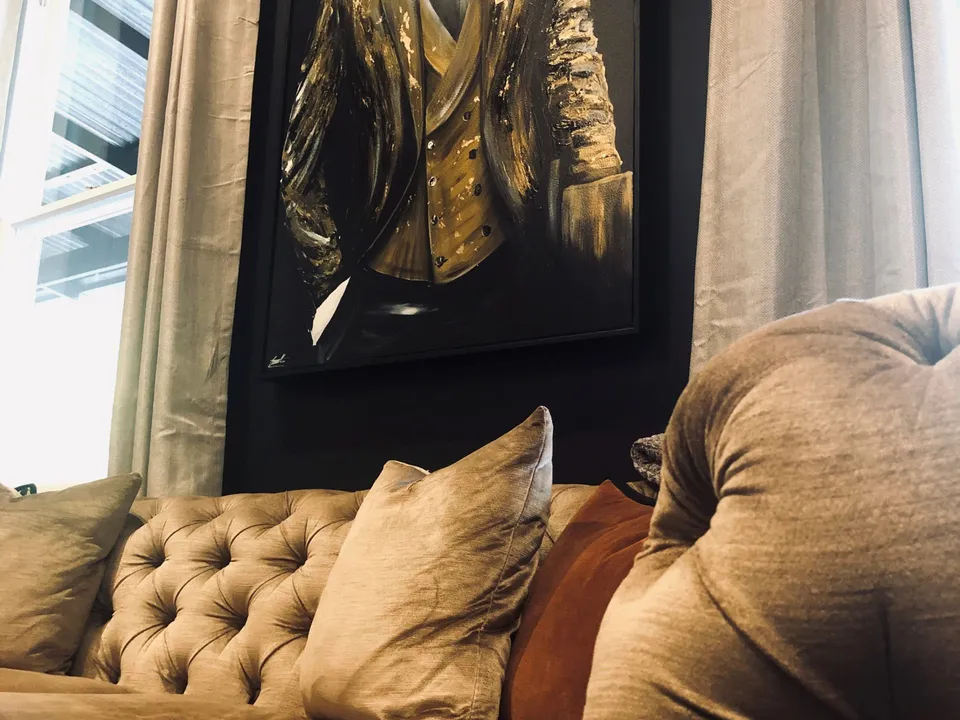 The Library with Chesterfield sofa and art collection