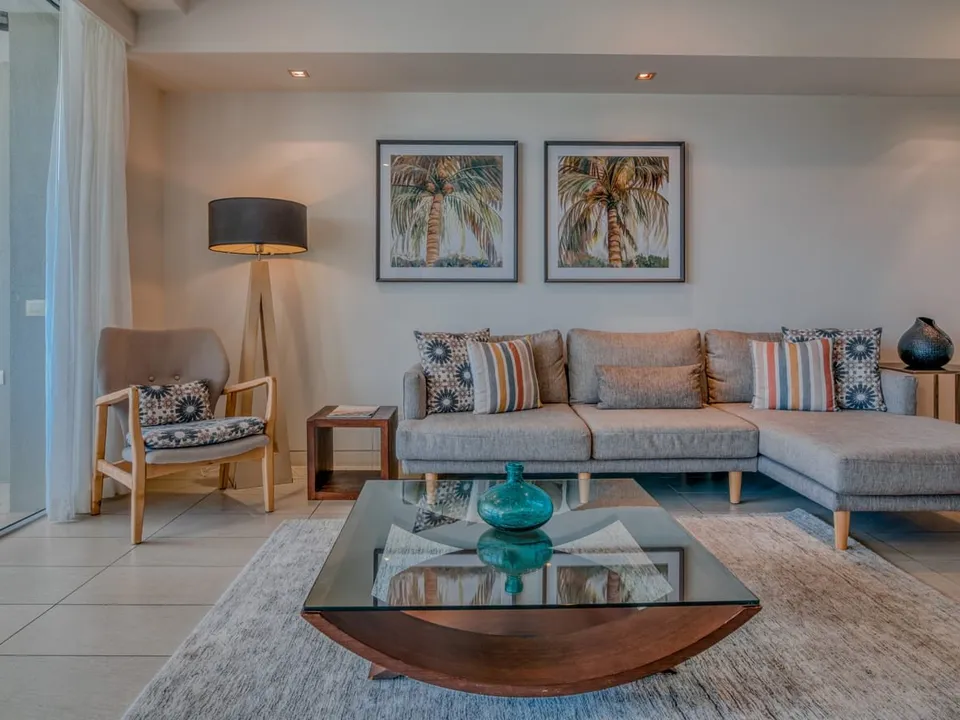 Stylish living area with tropical artwork