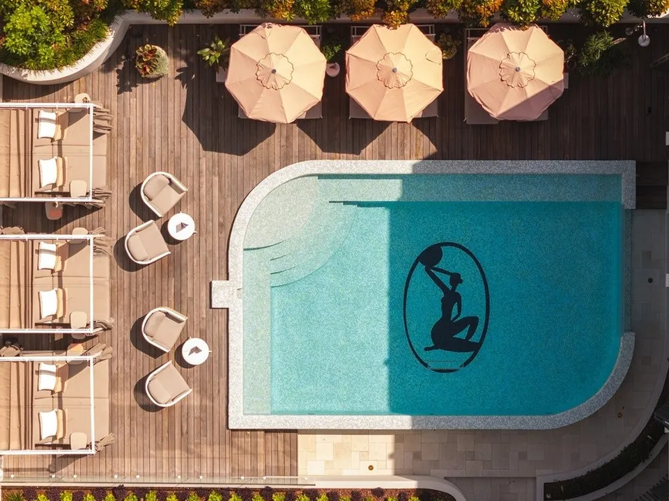 The heated magnesium pool with branded mosaic