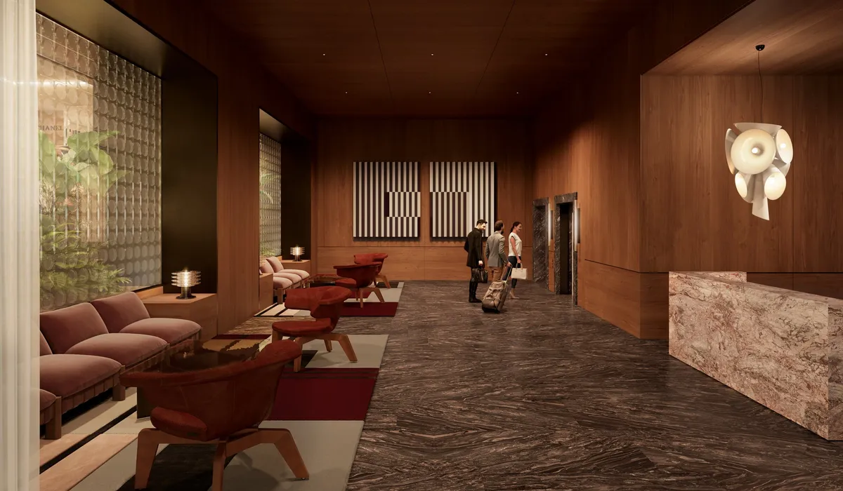 Render of InterContinental Brisbane's new lobby with timber-lined walls, a marble reception desk and low red armchairs