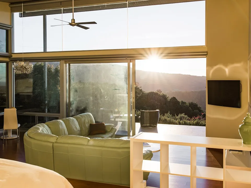 Luxury Suite with floor-to-ceiling windows and valley views