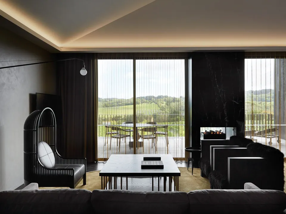 The Lair suite with vineyard views, double-sided fireplace, and bespoke Autoban Nest Chair