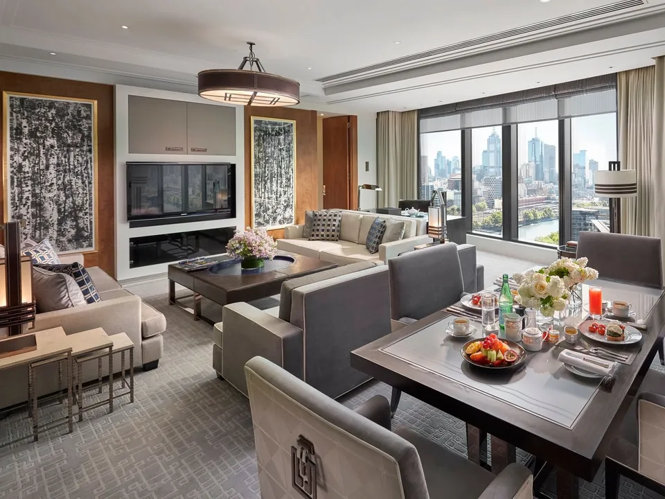 Crystal Villa living and dining area with custom furnishings and Melbourne skyline views